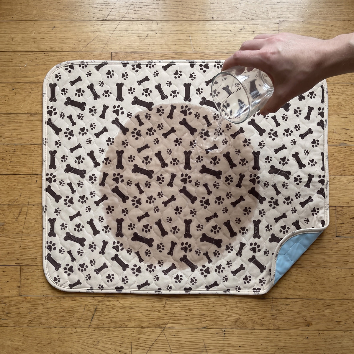 Water soaking into the quilted pad surface without pooling